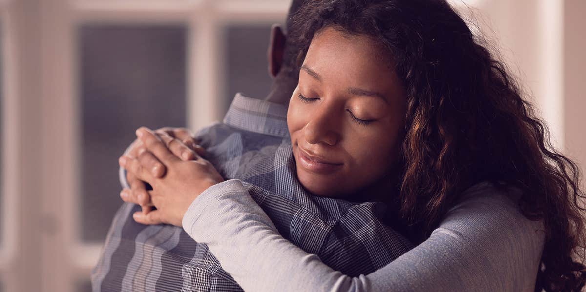 woman hugging someone