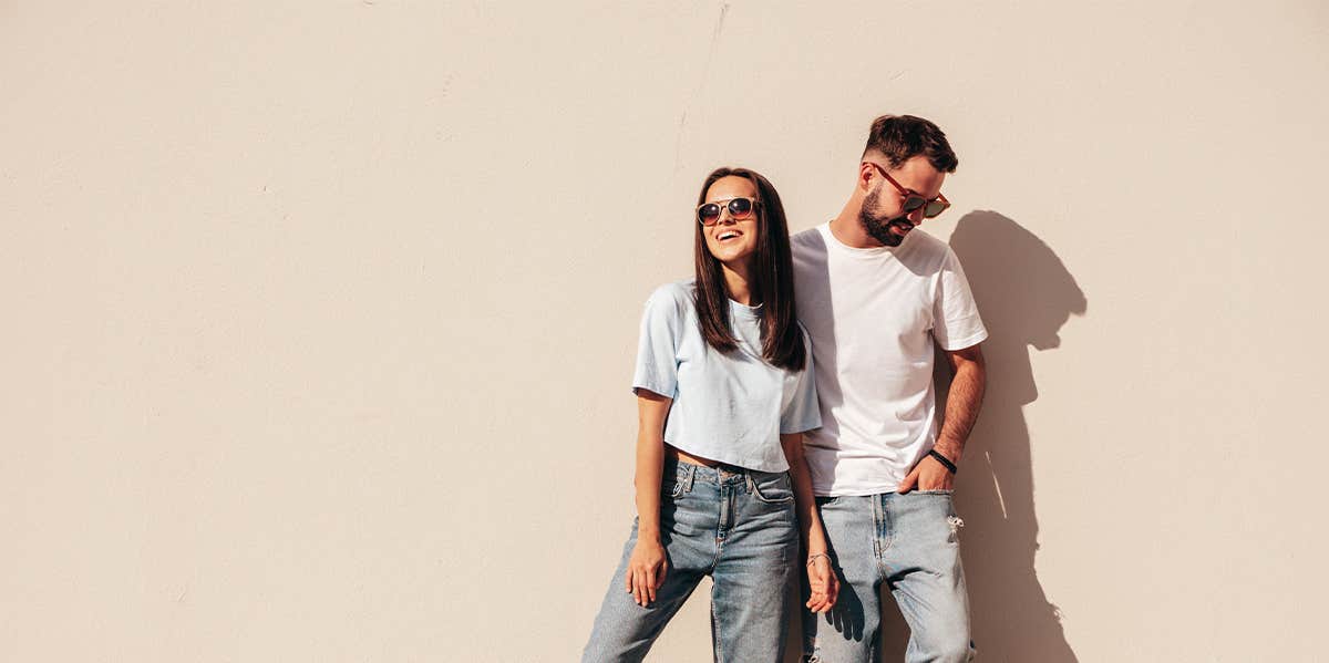 man and woman in matching outfits