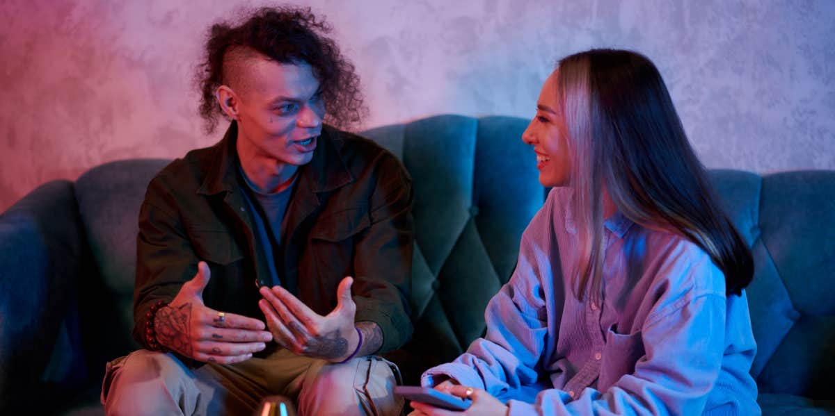 5 Icebreakers To Use On Women (That Actually Work) guy flirting with girl at party