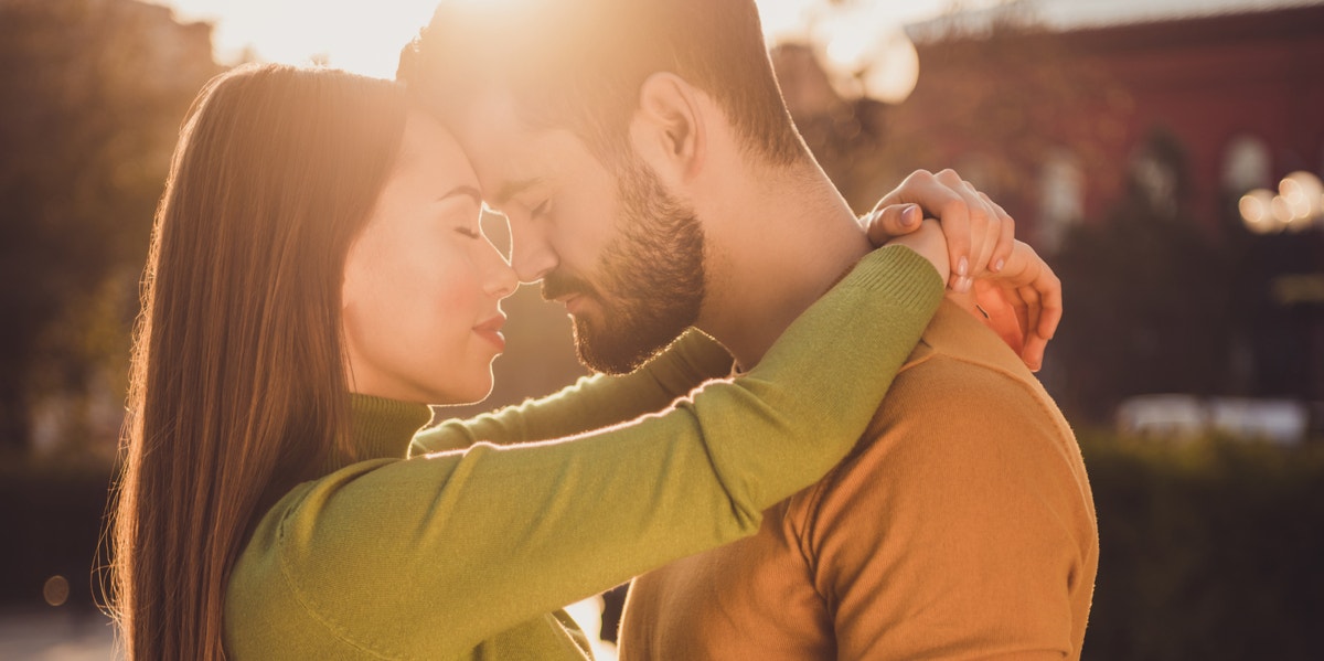 woman and man hugging 