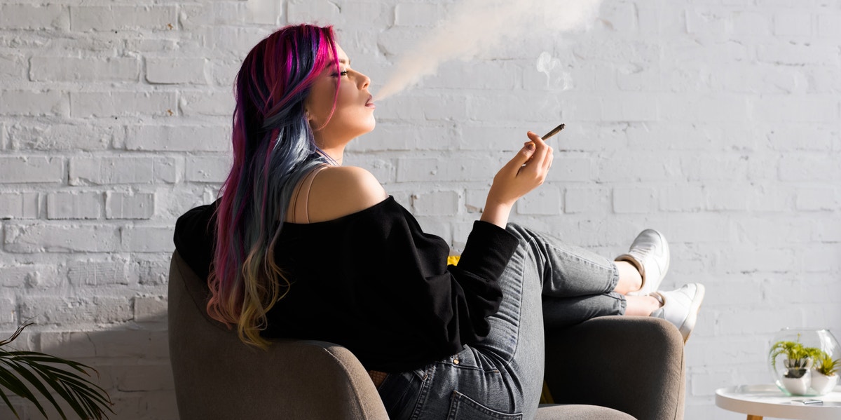How Much Marijuana You Should Smoke To Reduce Anxiety woman smoking marijuana