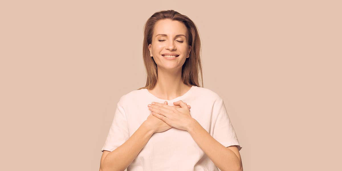 How My Child Accidentally Taught Me To Lighten Up woman holding hands against her heart