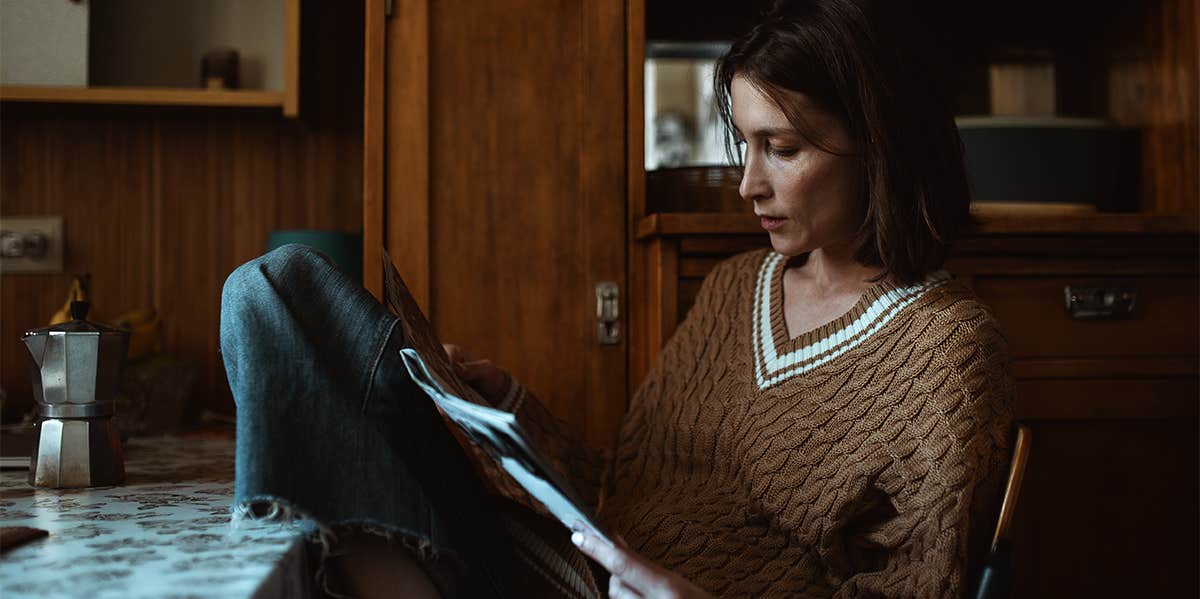 woman reading papers