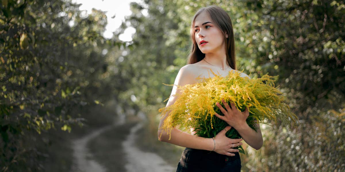 woman holding flowers