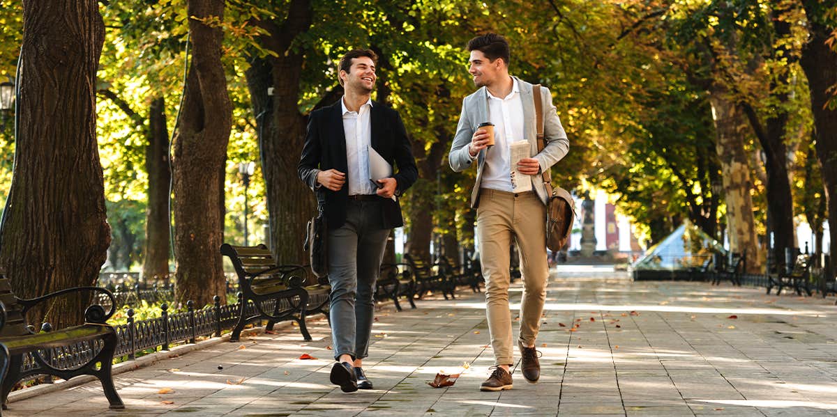 two business men walking together