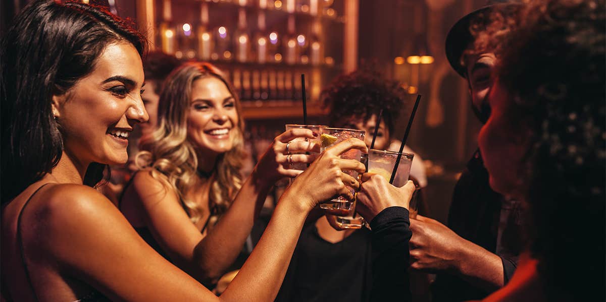 group of friends cheersing with drinks