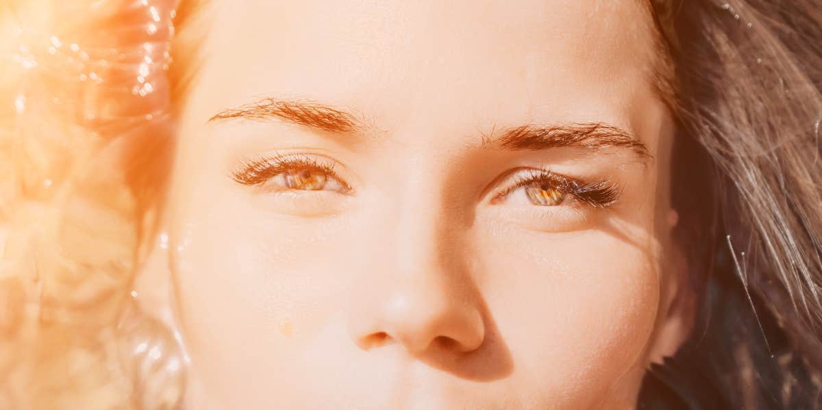 woman with sunlight in eyes