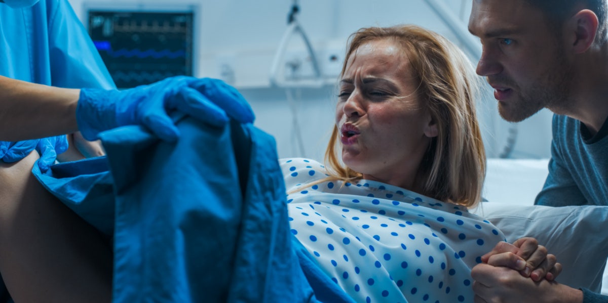 What It's Really Like To Push A Baby Out woman in childbirth labor