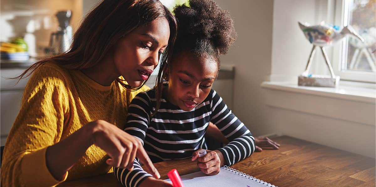 mom helping daughter with homework