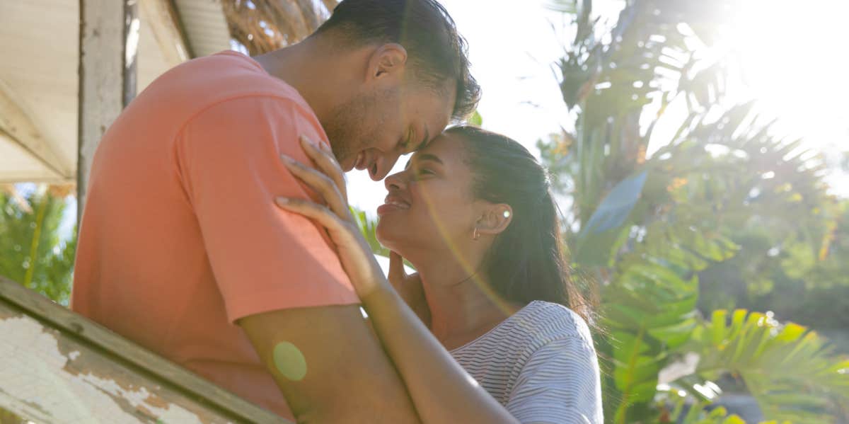 6 Ways To Prevent Men From Forcing Emotional Labor On You couple hugging in sunlight beam