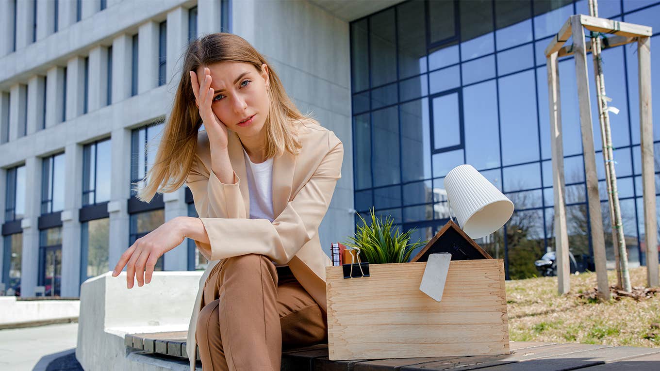 woman sitting outside after quitting job