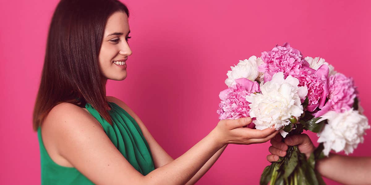 woman receiving flower