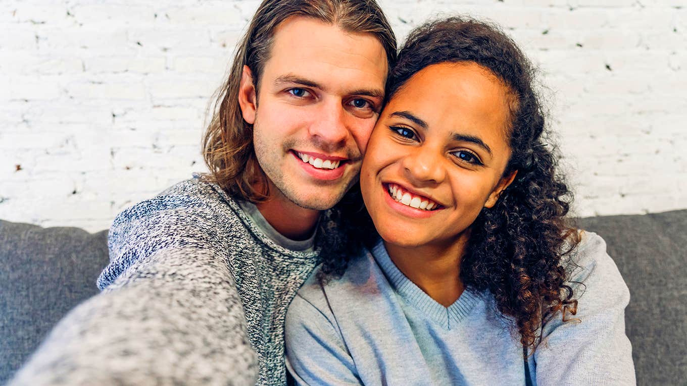 smiling couple taking photo together