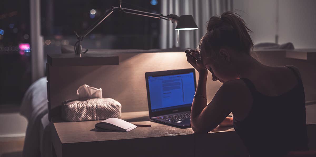 How To Stay Up All Night & Avoid Feeling Sleepy tired person at the computer