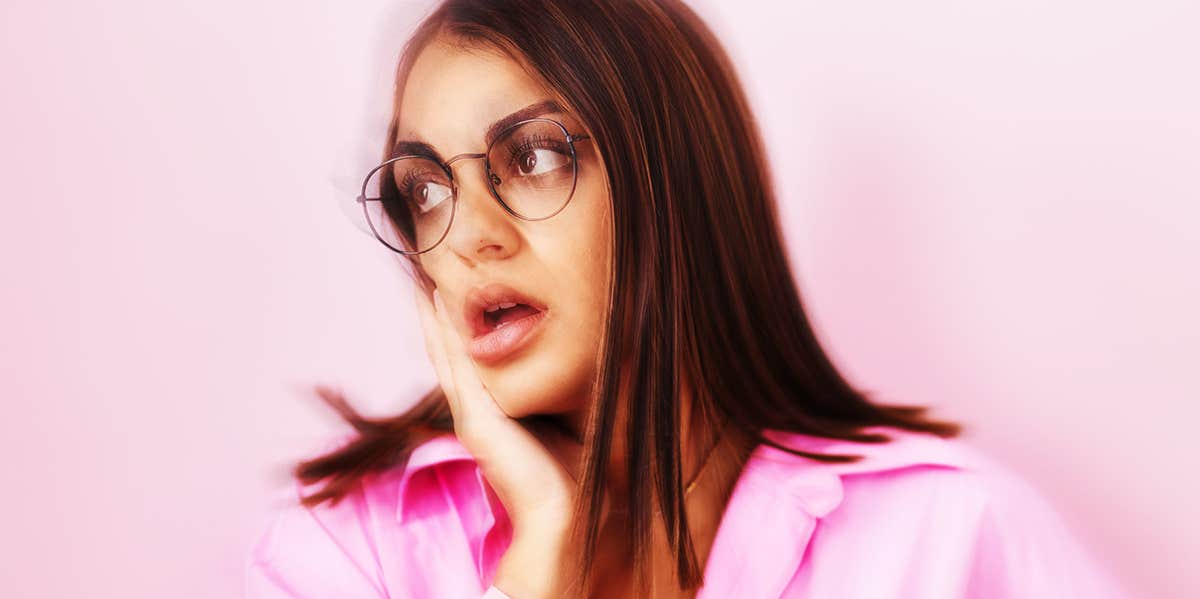 girl in pink shirt and glasses
