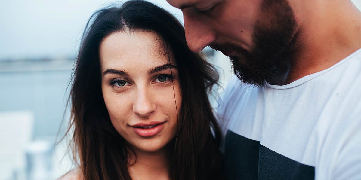 man holding woman close