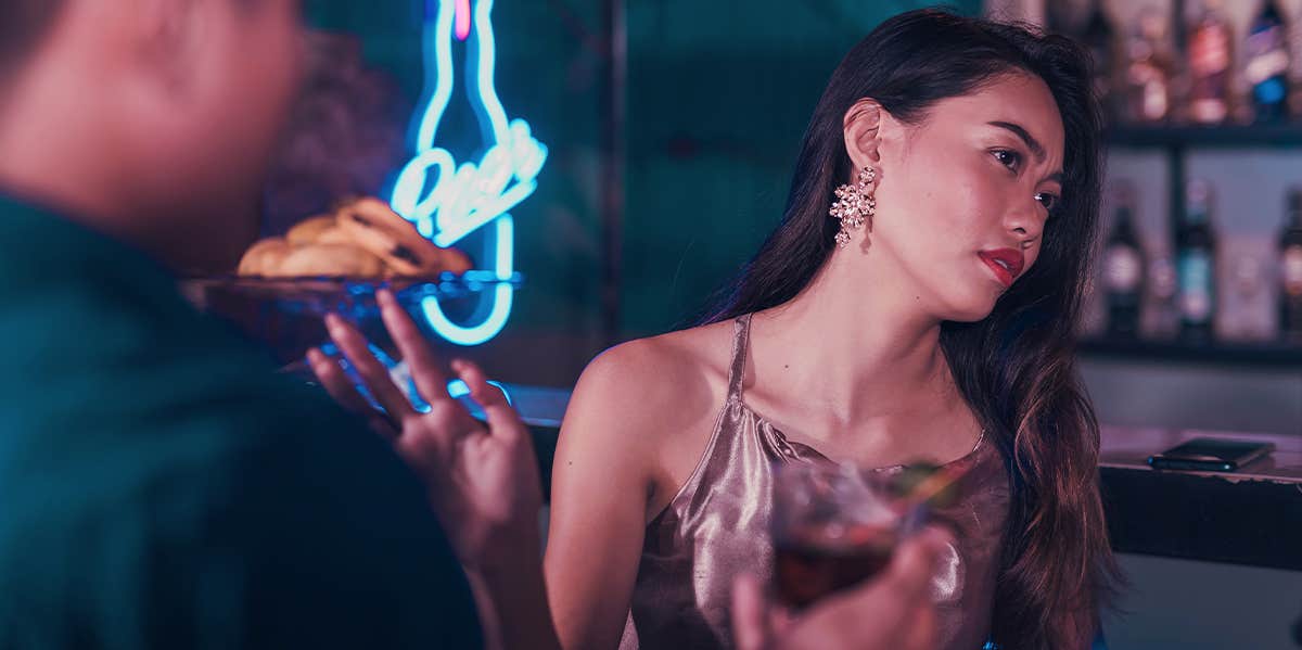 The Simplest Way To Tell She's Not Into You woman rejecting man at bar