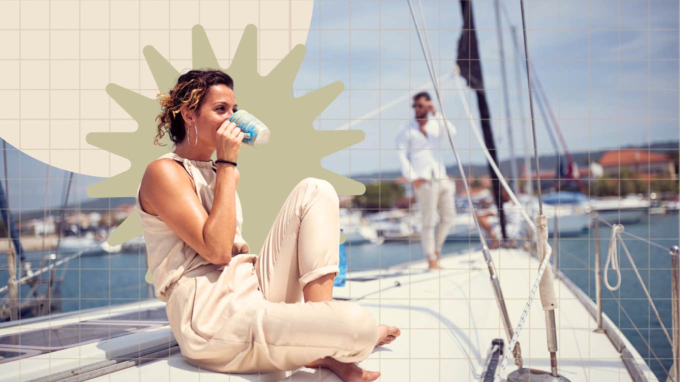 Woman enjoying a cup of coffee on a sail boat with her partner