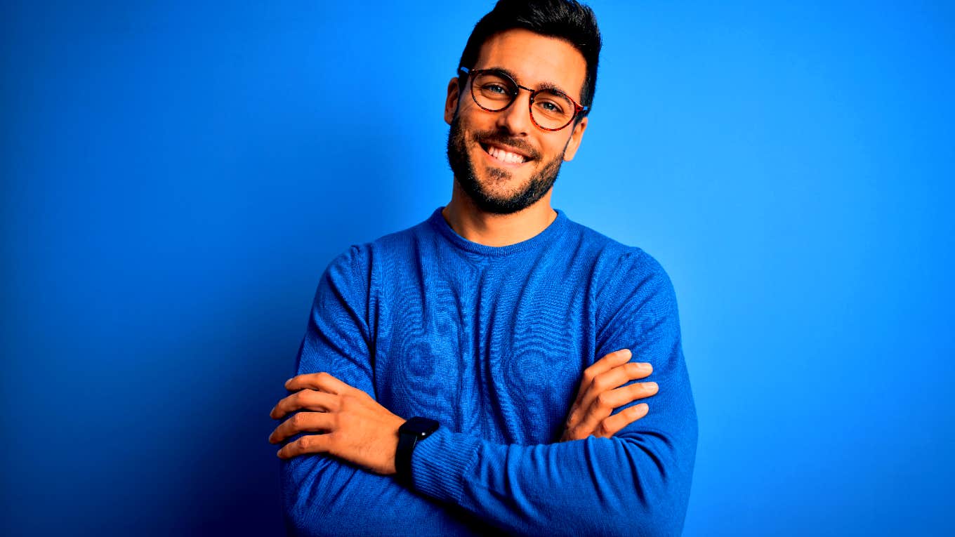 happy man in front of blue background
