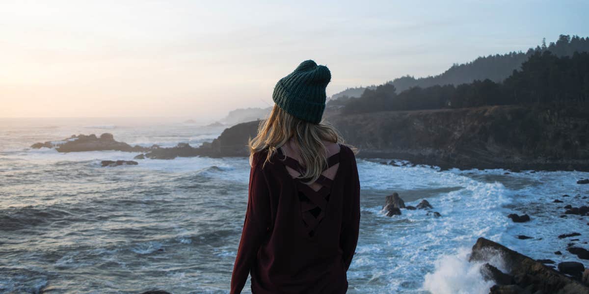 woman looking at ocean