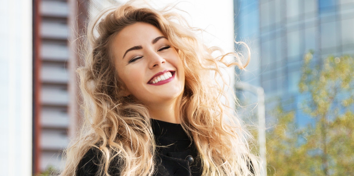 10 Ways To Make Yourself Happier In 30 Seconds Or Less smiling woman