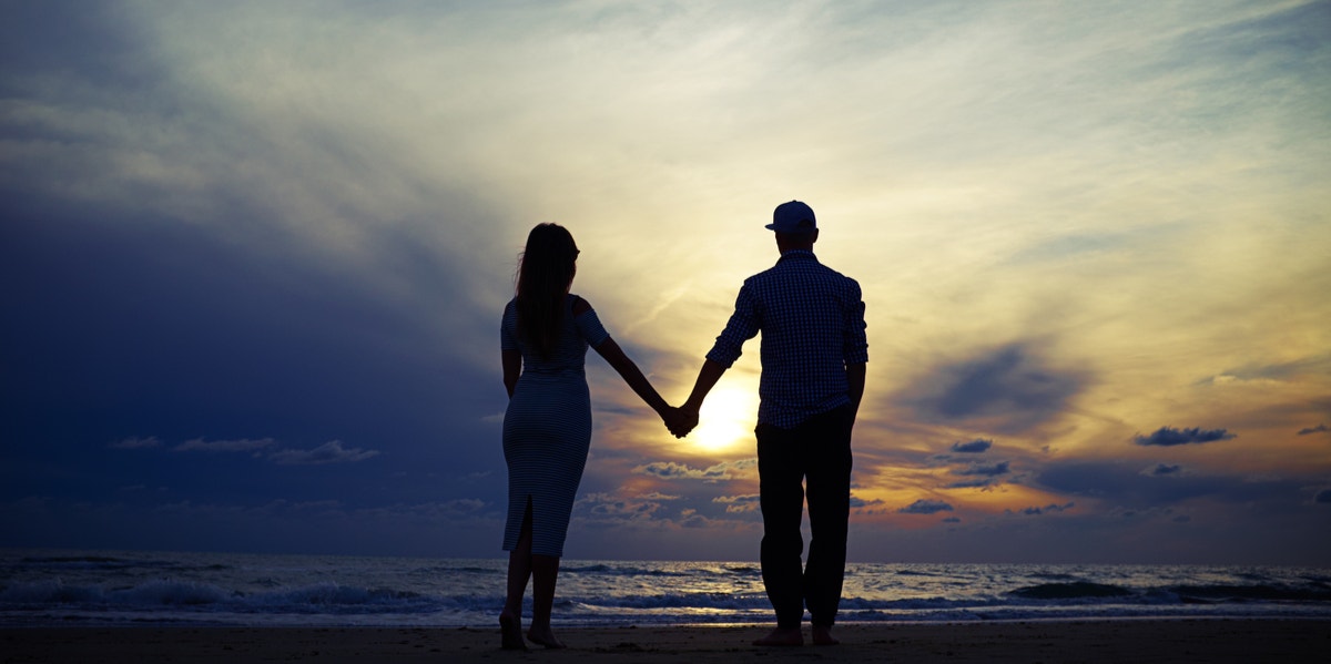 man and woman holding hands