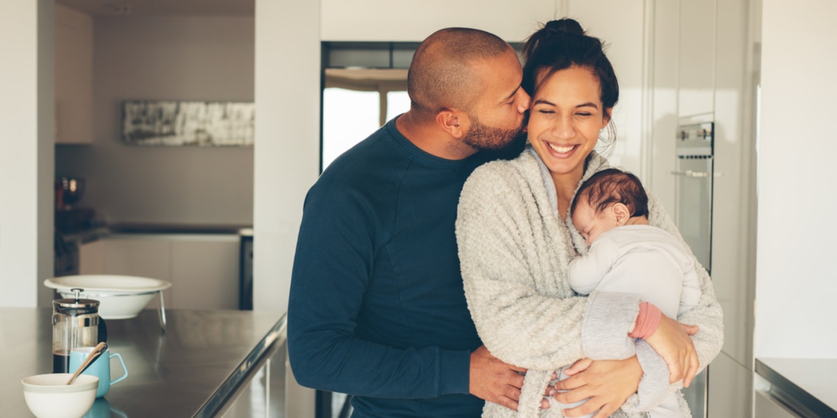 man kissing wife and mother