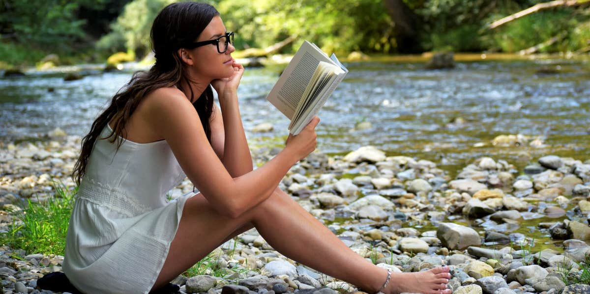 woman reading outside