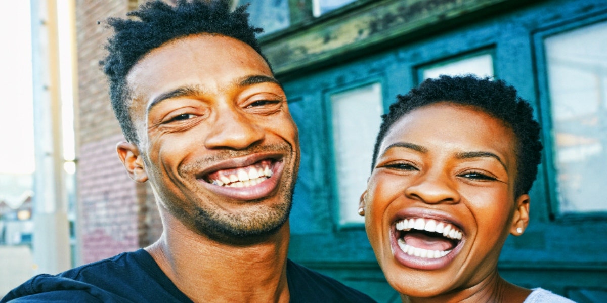 man and woman laughing together