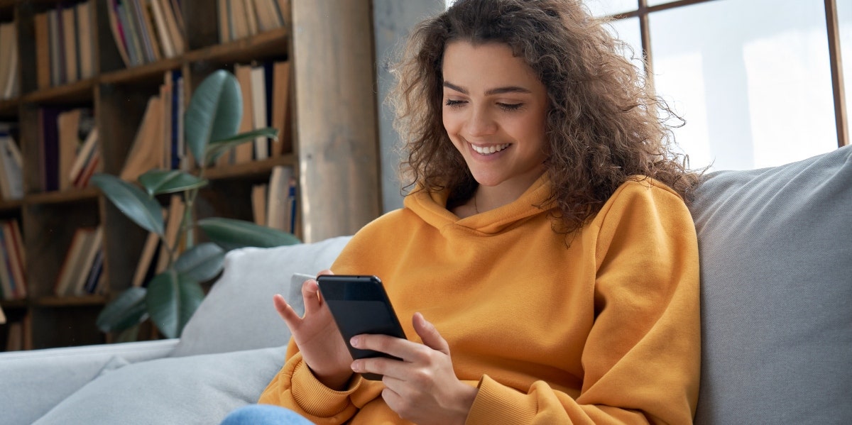 woman playing on her smartphone