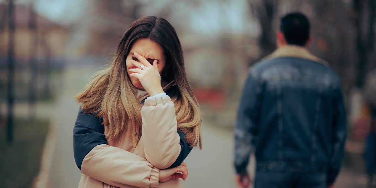 woman crying with man walking away