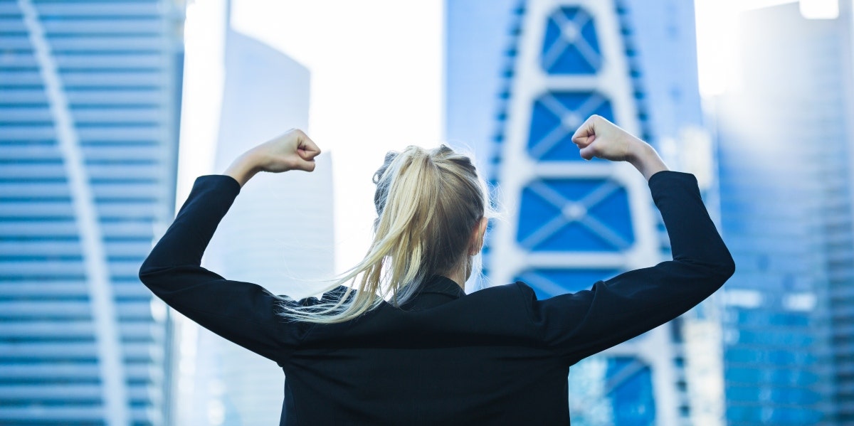 businesswoman in front of building