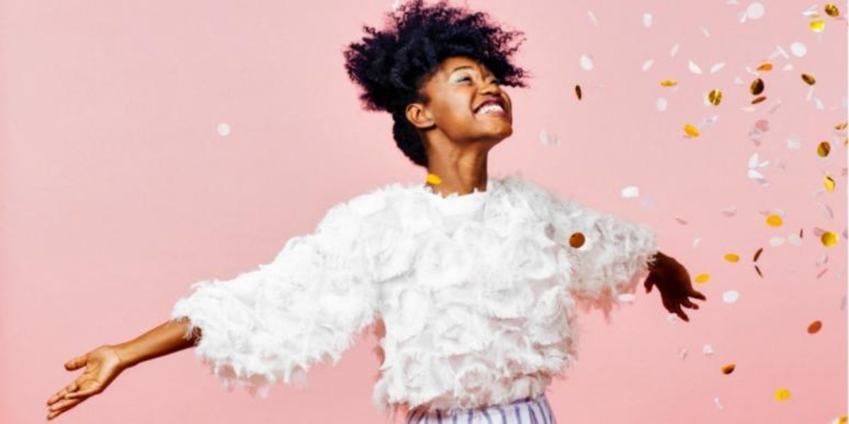 jubilant woman celebrating in confetti