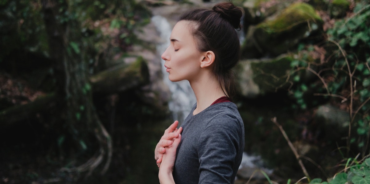 woman meditating in nature