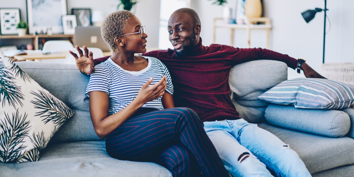 How To Communicate Effectively In A Relationship With A Pursuer-Distancer Communication Style couple on couch at home talking