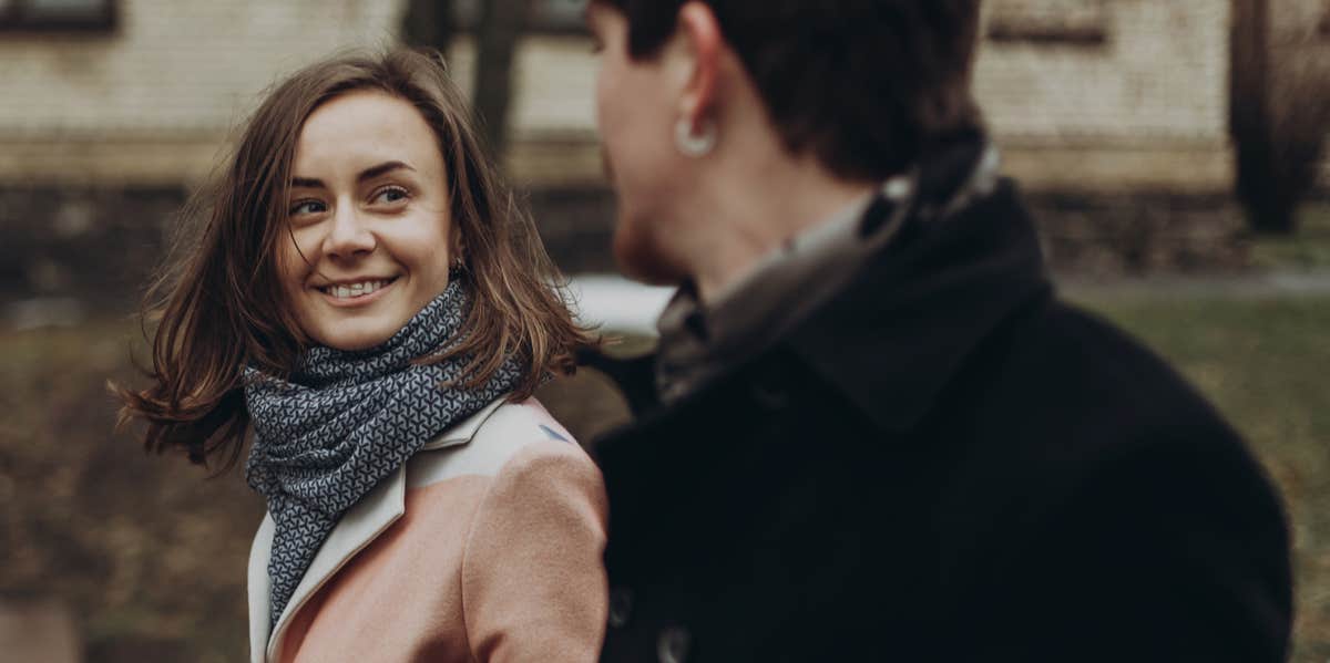 man and woman walking