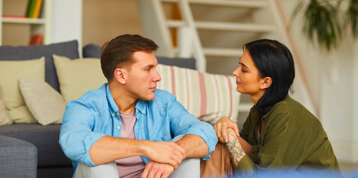 man and woman having a serious conversation