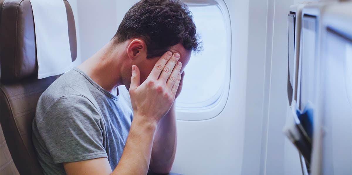 anxious man on plane