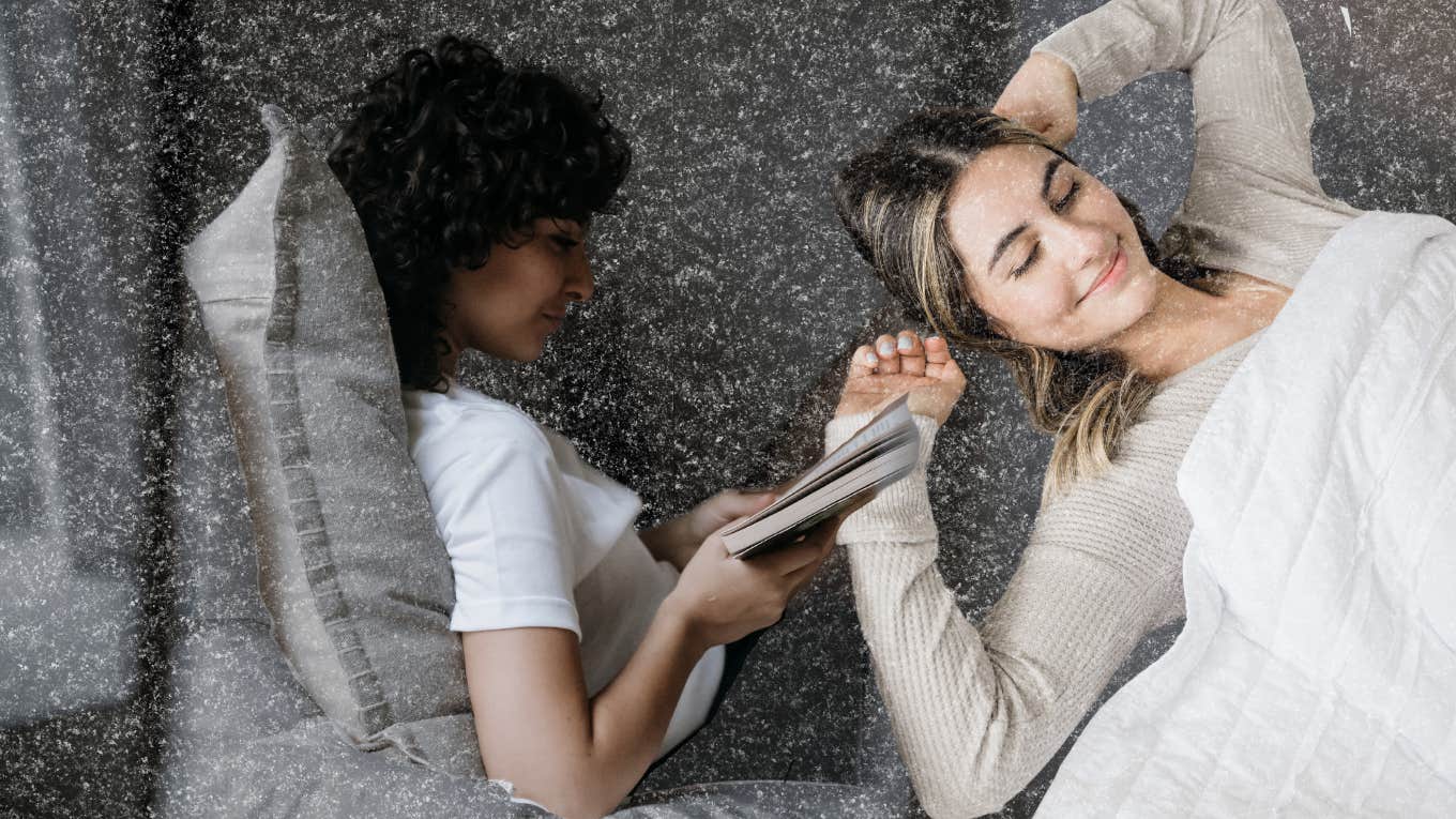 woman in bed, with no distractions just her paper book