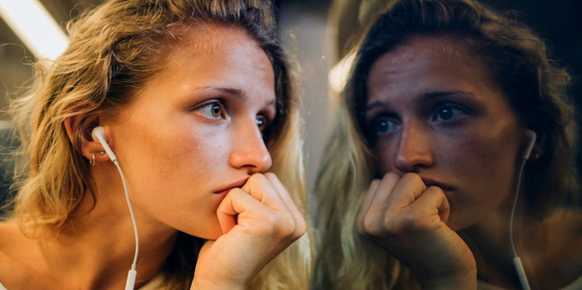 How To Deal With Guilt woman looking out window at her reflection