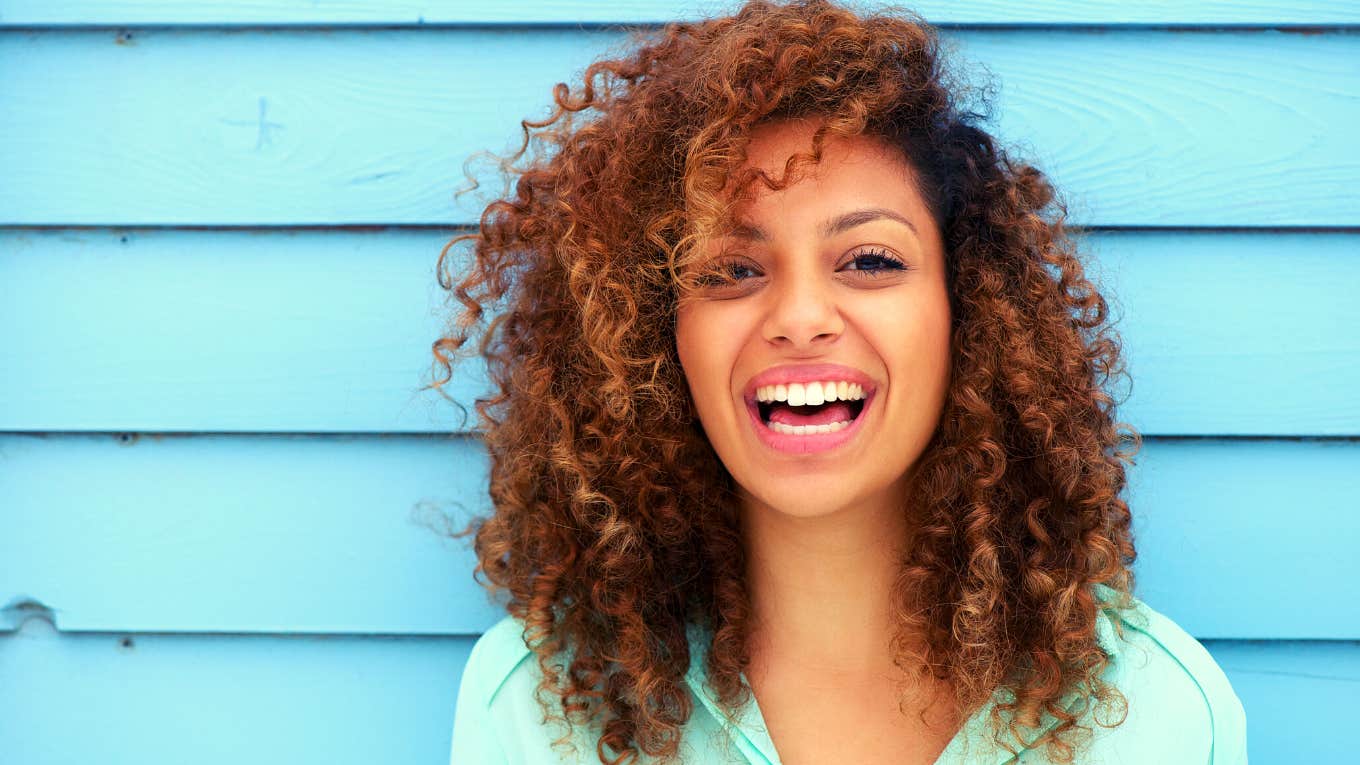 Portrait of a cheerful young woman smiling