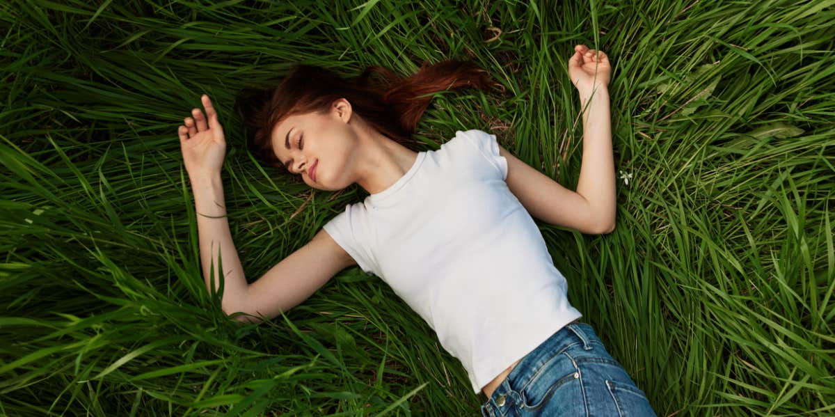 girl laying in grass