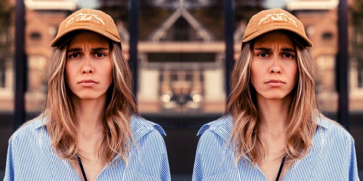 doubled image of woman wearing baseball cap