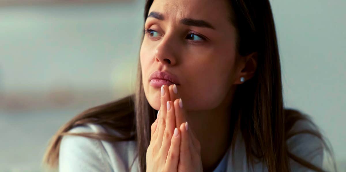 woman looking to the side wondering how to forgive someone