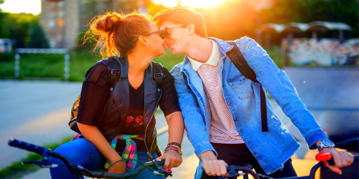 man and woman kissing