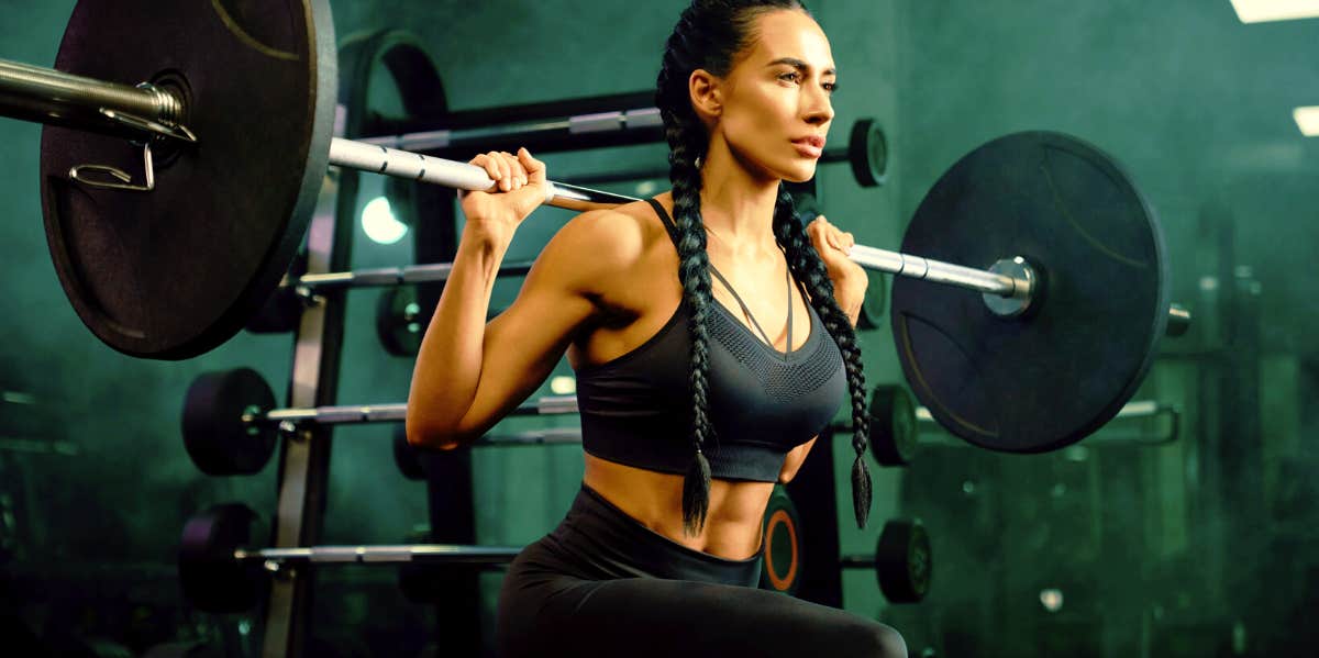 Woman doing barbell squats