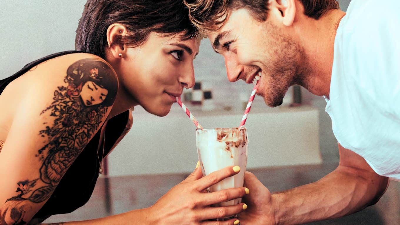 Couple sharing a milk shake 