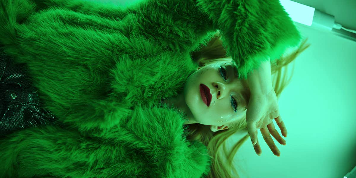 How To Get Over Someone As Soon As Humanly Possible woman wearing green coat