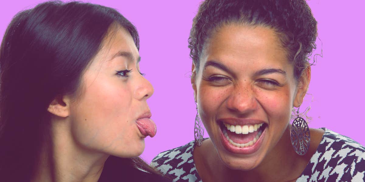 How To Get Your Best Friend Back friend sticking her tongue out playfully at laughing best friend