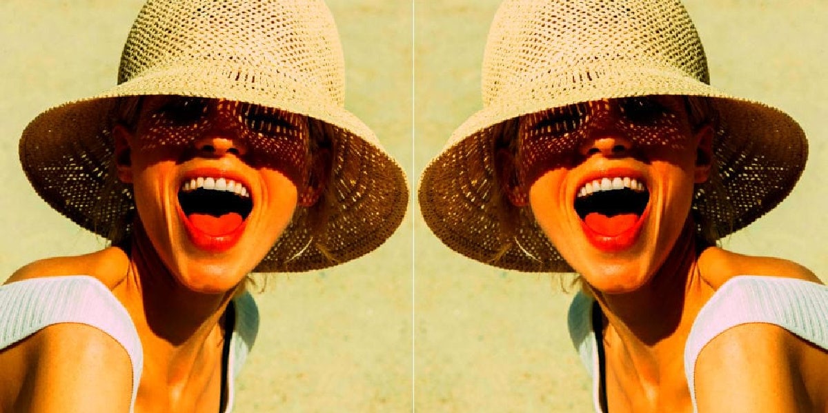 mirror image of woman in hat with her mouth open